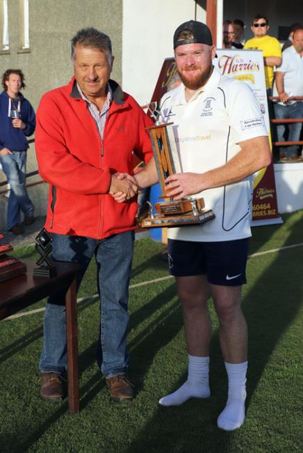 Glyn Cole presents the man of the match trophy to Adam James
